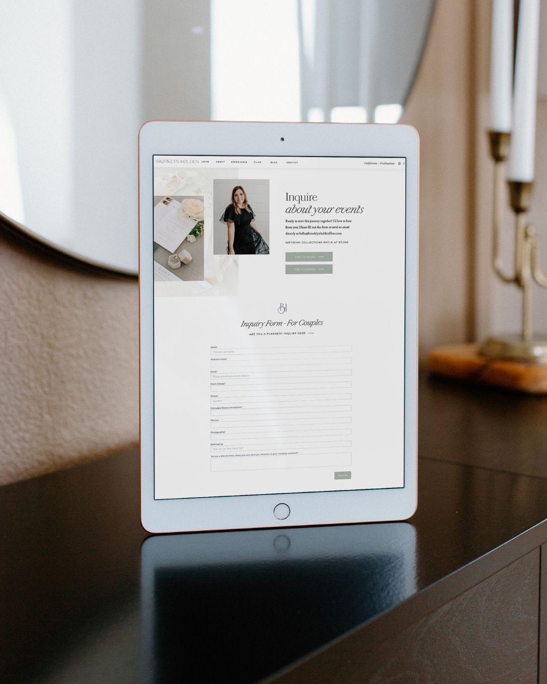 iPad on a desk showing a contact page for a wedding videographer