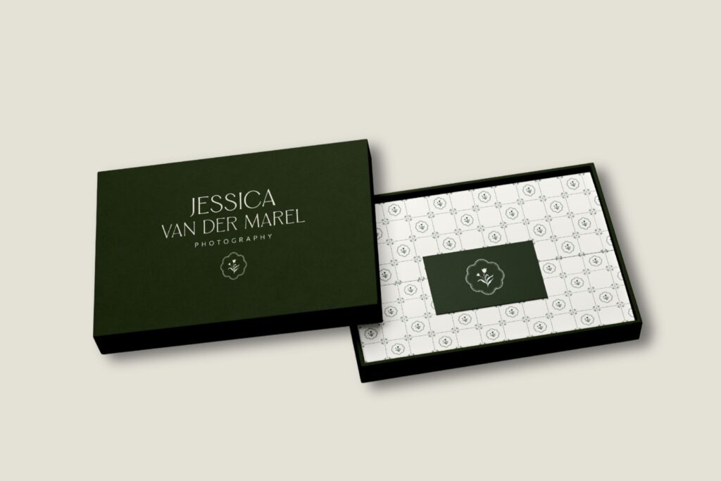 Branded stationery mockup with green business card and patterned envelope for Jessica Van Der Marel.