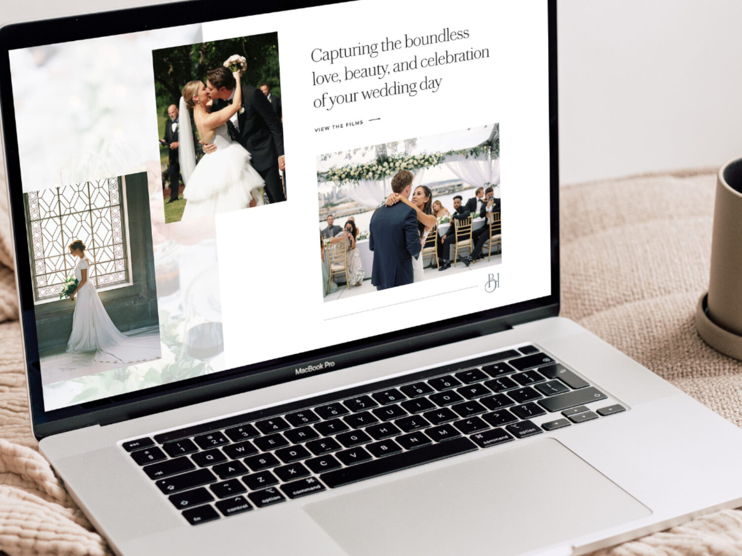 Laptop displaying a refined wedding videography website with romantic imagery and minimal design.