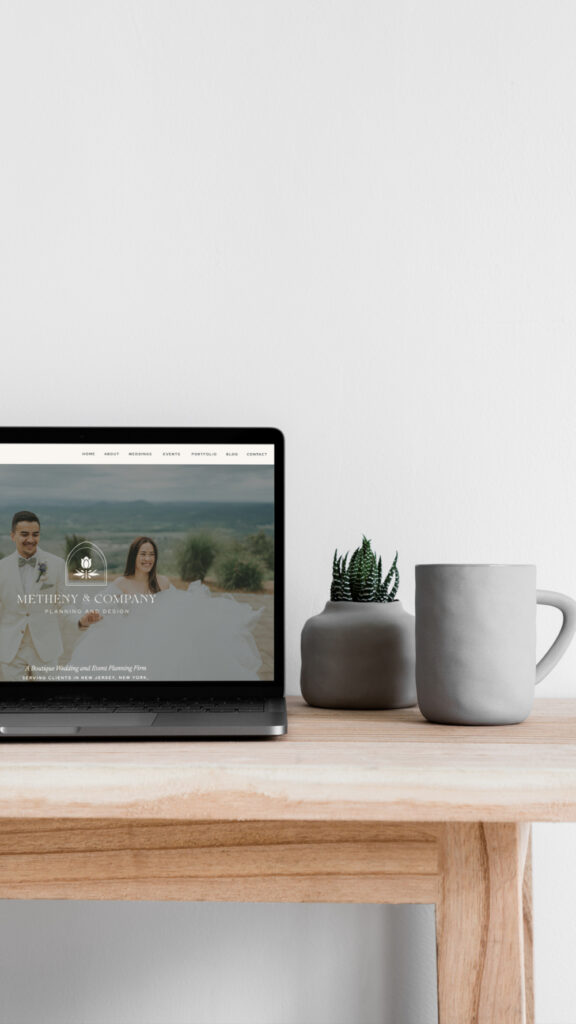 Showit website builder displayed on laptop featuring elegant wedding planner website homepage design.